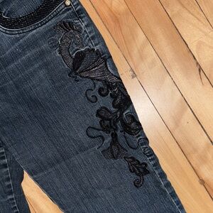 Women's Dark Blue Jeans with floral on side.